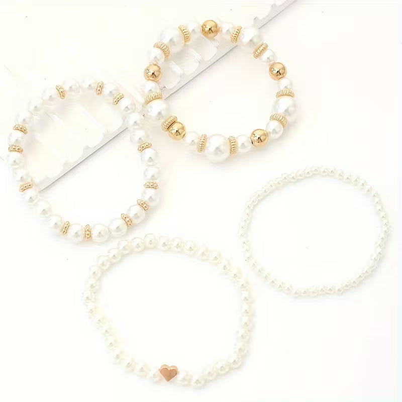 Armbanden met witte parels | Goud