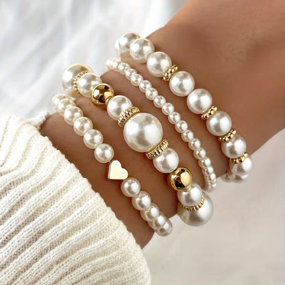 Armbanden met witte parels | Goud
