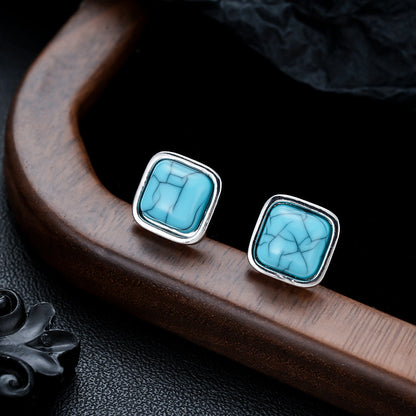 Vierkante turquoise oorknopjes in wit goud