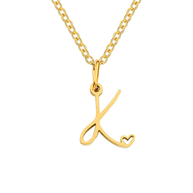 Initialenketting met hart in goud