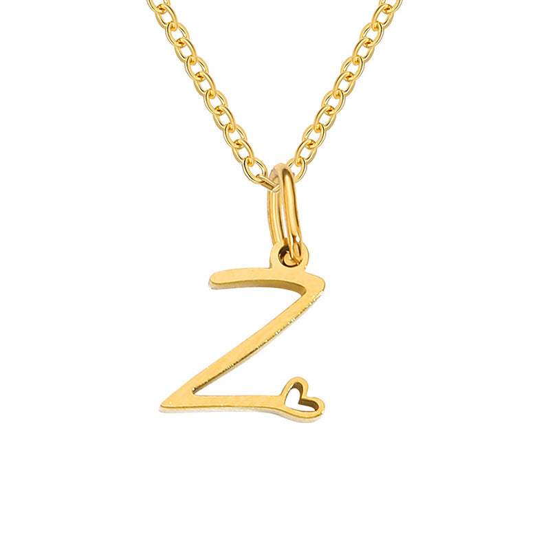 Initialenketting met hart in goud