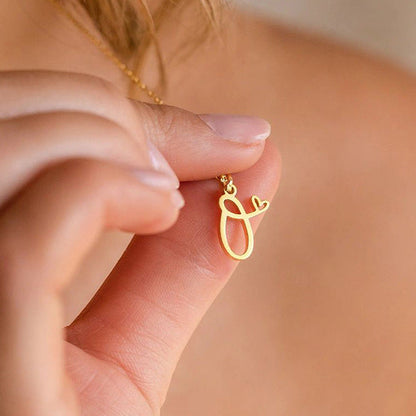 Initialenketting met hart in goud