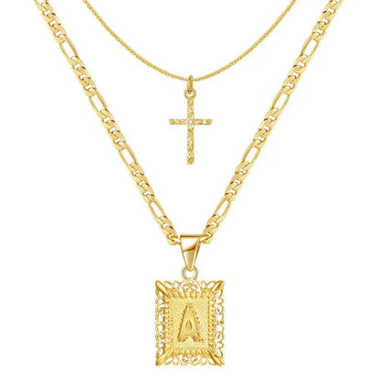 Gekruiste initialenketting in goud