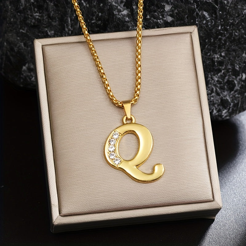 Initialenketting met kristallen accent in goud
