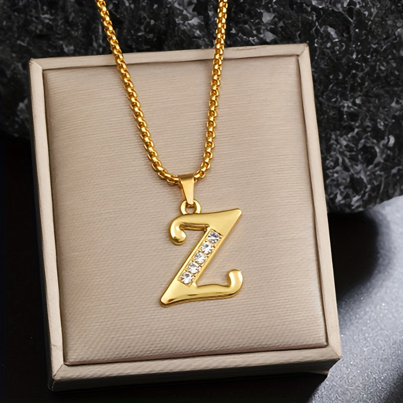 Initialenketting met kristallen accent in goud
