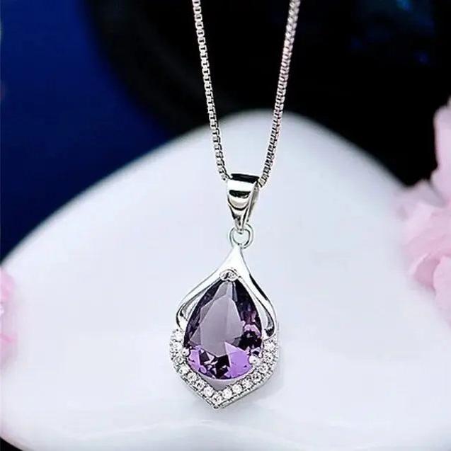 Ketting met paars kristal in goud