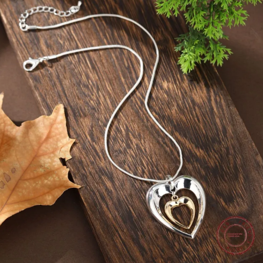 Ketting met tweekleurig hangend hart in tweekleurig goud