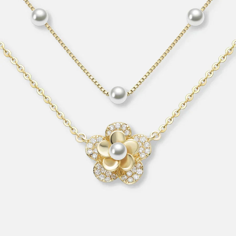 Bloemenketting met dubbele parels in goud