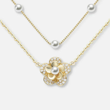 Bloemenketting met dubbele parels in goud