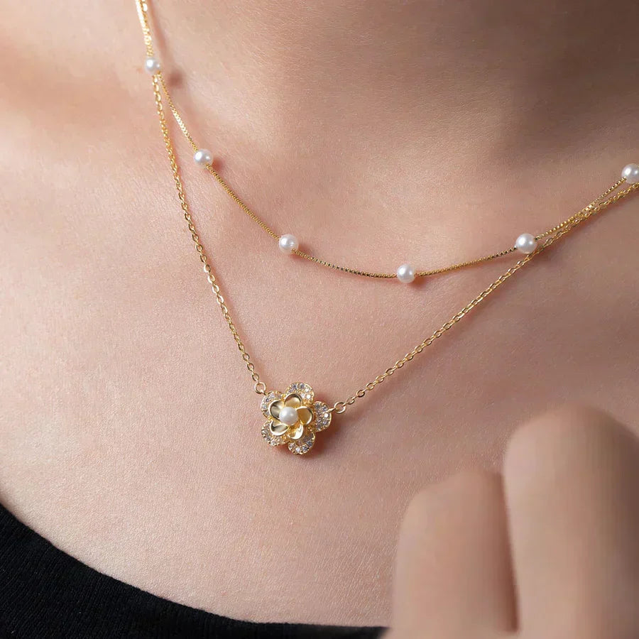 Bloemenketting met dubbele parels in goud