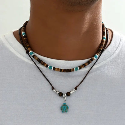 Luxe herenketting met turquoise en tijgeroog-kralen in goud