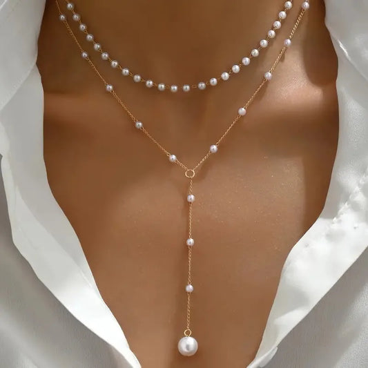 Tweerijige parelketting met hangers | Goud