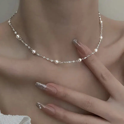 Elegante ketting met glanzende parels in goud