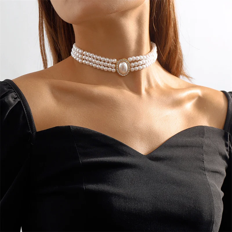 Elegante ketting met drie parels in goud