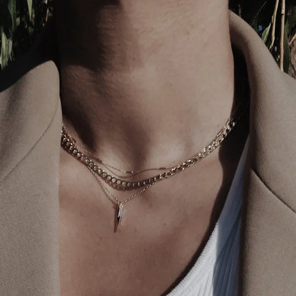 Platte schakelketting in goud