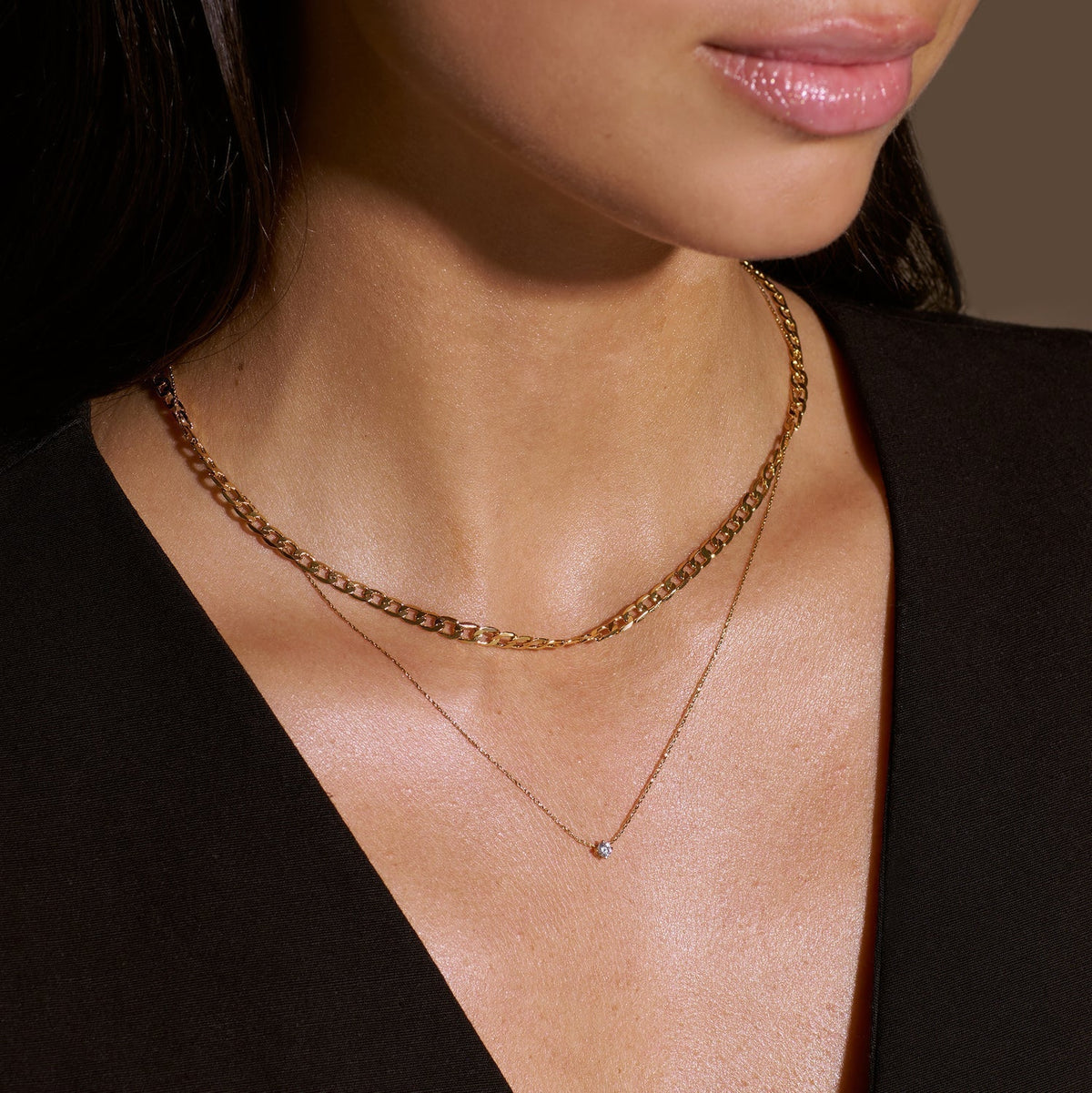 Platte schakelketting in goud