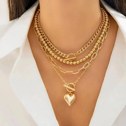 Gelaagde hartketting in goud