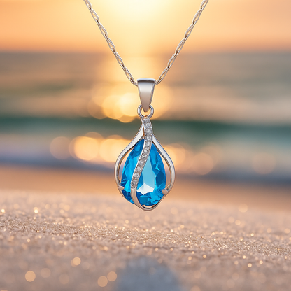 Handgemaakte druppelketting met blauwe steentjes in goud