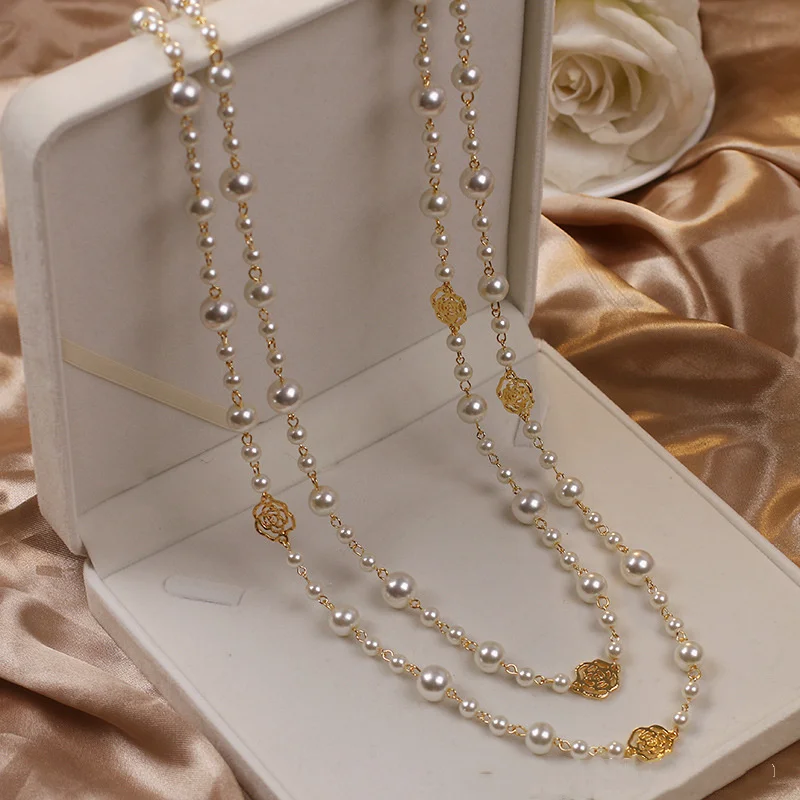 Elegante ketting met klein pareltje in goud