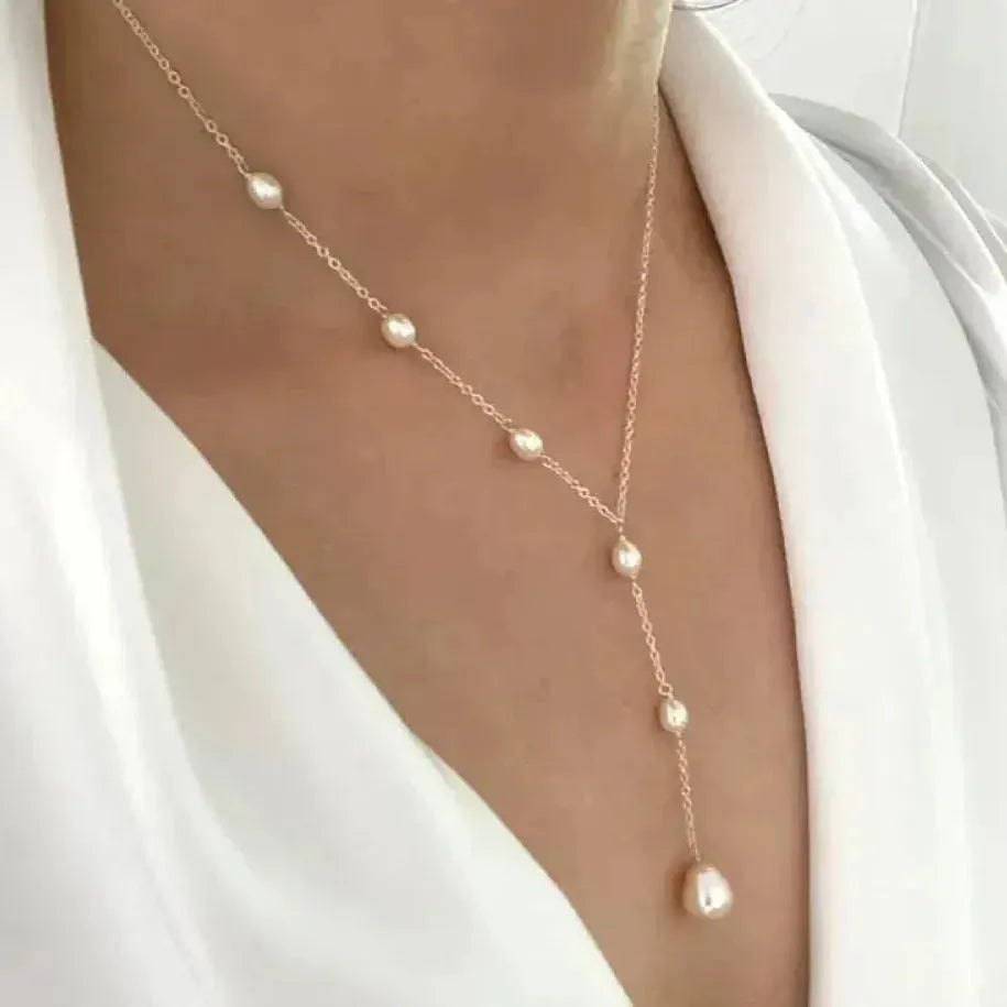 Retro ketting met hangende parel in goud
