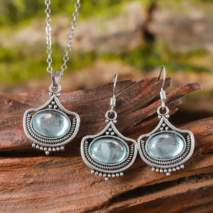 Retro ketting en oorbellen met blauwe ovale edelstenen in goud