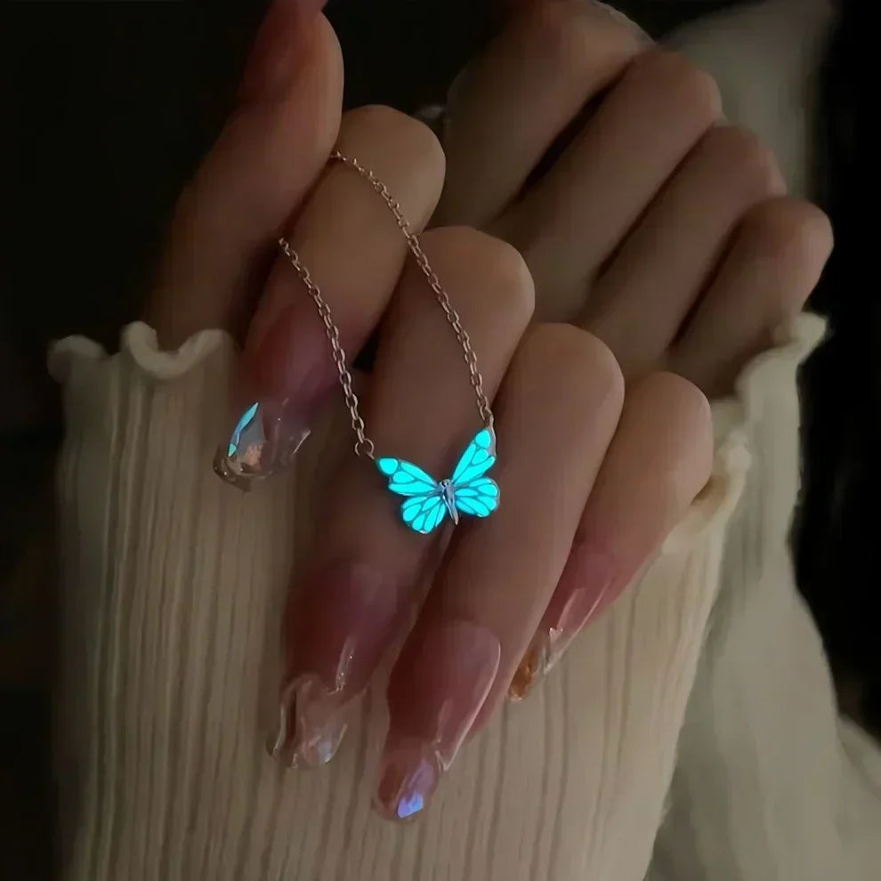 Ketting- en armbandset met stralende blauwe vlinder | Goud