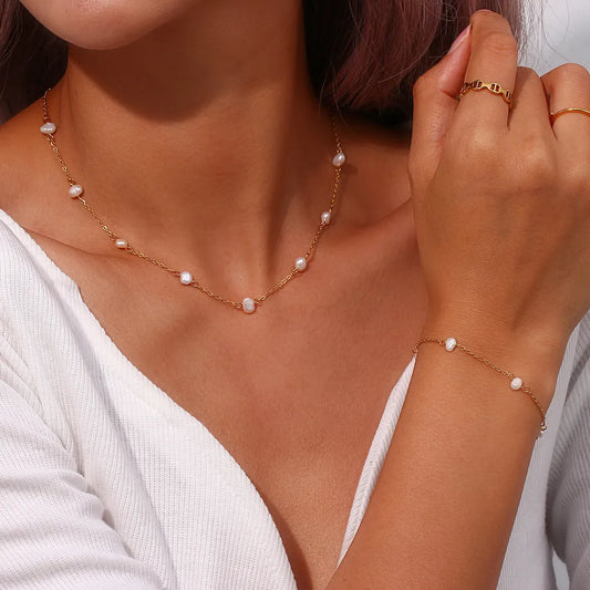 Complete roestvrijstalen ketting- en armbandset met madeliefjes | Goud