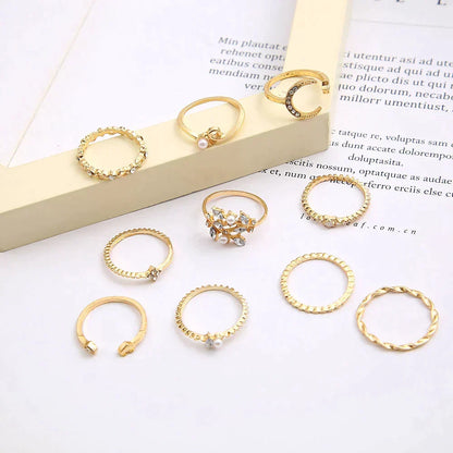 Set van 10 sierlijke ringen in wit goud