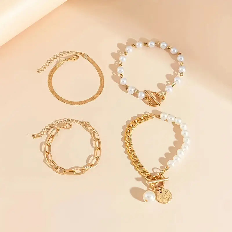 Chique armbandenset – slang, parels en schakels in goud