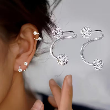Lichte luxe oorbellenset met spiraalbolletjes en steentjes in goud