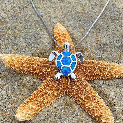 Ketting- en oorbellenset met opaal zeeschildpad in wit goud