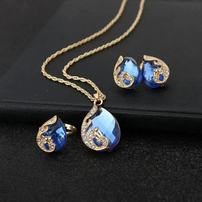 Ketting- en oorbellenset met blauw kristal en verguldsel in goud