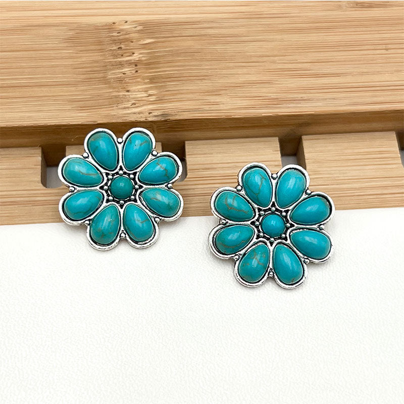 Turquoise bloemblad-oorknopjes Serelith in wit goud