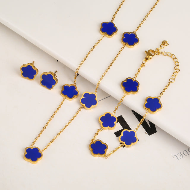 Set armband, ketting en oorbellen met klaver in goud
